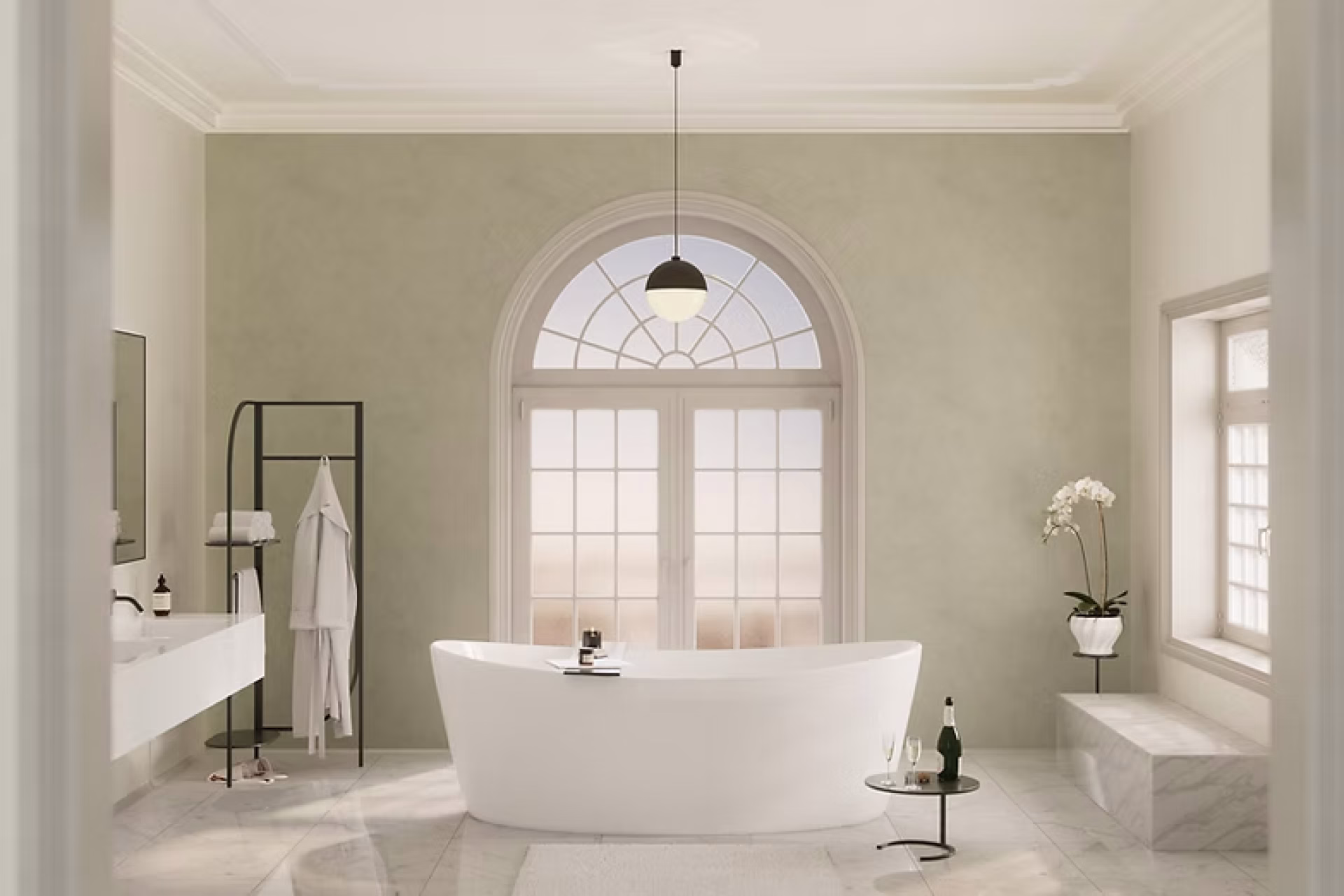 Luxury bathroom with freestanding soaking tub, arched window, and marble flooring by GIL Renovation Services.